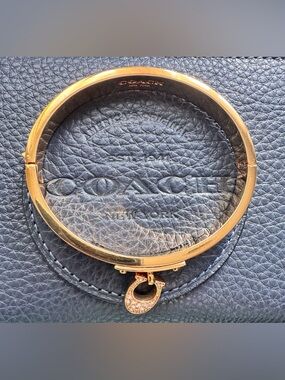 Coach gold tone bangle bracelet with push down clasp easy opening rhinestone “C”